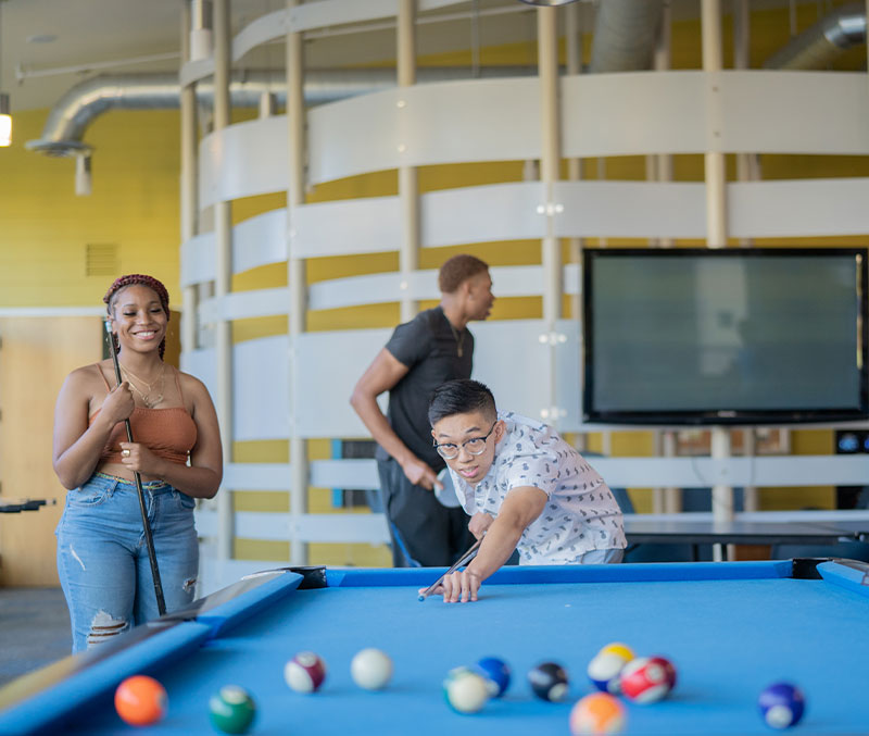 Group of residents playing pool